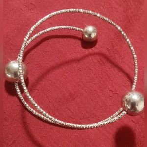 Silver floating orb bracelet with silver ball ends